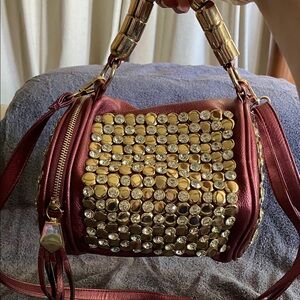 Elegant Gold and Red Studded Handbag